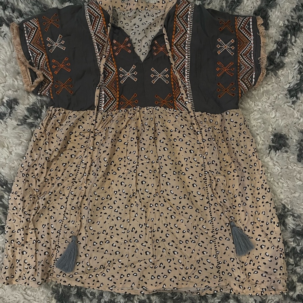 Leopard print top with Aztec design stitching and ties with tassels